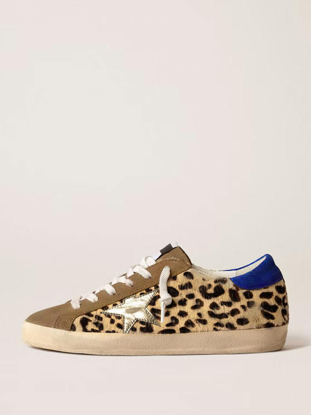 Image of Sneakers da skate leopardate da donna Sneakers con lacci in pelle scamosciata con motivo a stella patchwork in pelliccia sintetica