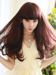 Perruque femme longue brun acajou ébouriffée de boucles en bas et frange droite