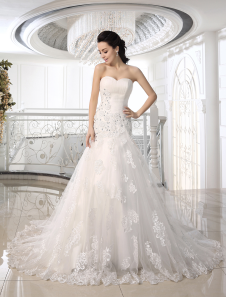 Robe de mariée sirène en tulle ivoire avec fleur encolure en coeur