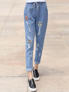 Jean féminin style sarouel en denim bleu antique troué