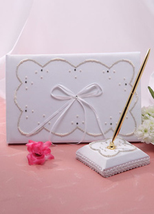 Perle d'Ivoire arcs mariage livres et stylos